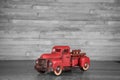 Vintage 1950`s red pickup truck on a black and white background