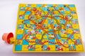 Vintage 1960s Snakes and Ladders board game. Made in England in sixties