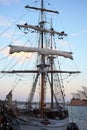 Furl the sails on sailing ship by dusk in harbor city Sydney Royalty Free Stock Photo