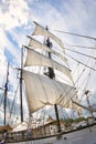 Vintage sailing ship mast ropes and tackle, Tall ship rigging mast detail, blue sky