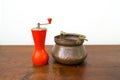Vintage salt bowl and pepper grinder on wood table