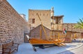 The vintage sambuk fishing boat and arish summer house in Al Fahidi Fort, Dubai, UAE Royalty Free Stock Photo