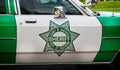Vintage San Diego California Sheriff insignia on side of Highway Patrol police car parked outside The Jefferson memorial in Washin Royalty Free Stock Photo