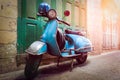 Vintage scooter stands in an alley. Post process in vintage style Royalty Free Stock Photo