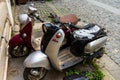 Vintage scooters stand deserted in an alley in old town of Bucharest, Romania, 2020