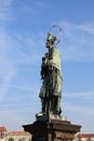 Vintage sculpture of John of Nepomuk on the Charles bridge in Prague Czech Republic