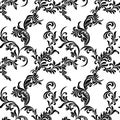 Vintage seamless pattern. Black luxurious Vegetative tracery of stems and leaves isolated on a white background.