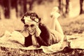 Vintage sepia portrait of a girl in summer forest Royalty Free Stock Photo