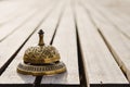 Vintage service bell on wooden surface Royalty Free Stock Photo