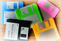 Vintage set of floppy discs on wooden desk background Royalty Free Stock Photo