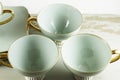 Vintage set of mint green China teacups and saucers. Royalty Free Stock Photo