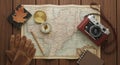 A vintage setup featuring a map of Europe spread on a wooden surface Royalty Free Stock Photo