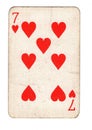A vintage seven of hearts playing card.