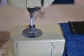 Vintage sewing machine close up with jeans. Hobbies and leisure. Royalty Free Stock Photo