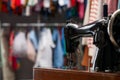 Vintage sewing machine with thread in workshop, closeup. Space for text Royalty Free Stock Photo