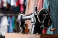 Vintage sewing machine with thread in workshop, closeup Royalty Free Stock Photo