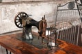 Vintage sewing machine on a wooden table Royalty Free Stock Photo