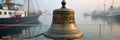 Vintage ship bell with harbor background in misty atmosphere Royalty Free Stock Photo
