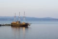 Vintage ship in dock ocean bay calm waters scenic nautical view , copy space for your text here Royalty Free Stock Photo