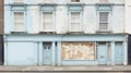 Vintage Shop Facade. Captivating Worn Blue and White Paint, Closed Shutters, and Grimy Windows