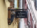 Vintage shop signpost sing board from a small village in France