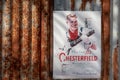 Vintage sigarette poster advertising Chesterfield mounted on rusty corrugated iron Royalty Free Stock Photo