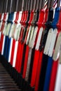 Vintage signal levers all lined up in a preserved heritage railway signal box. Levers are colour coded and numbered