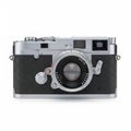 Classic silver and black rangefinder camera with lens Royalty Free Stock Photo