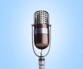 Vintage silver microphone close up on blue background 3d render Royalty Free Stock Photo