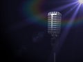 Vintage silver microphone in spotlight on black . 3D render illustration. Royalty Free Stock Photo