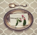 Vintage silver platter and spoon place setting Royalty Free Stock Photo