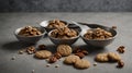 Vintage silver spoons with brown cookies of walnuts shape on grey concrete background