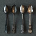 Vintage silver spoons on leather surface. 3d render
