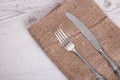 Vintage silver tableware knife and fork is on napkin Royalty Free Stock Photo