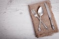 Vintage silver tableware knife, spoon and fork is on napkin Royalty Free Stock Photo