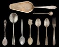 Vintage Silverware, antique spoons, knives, cake shovels isolated on isolated black background. Antique silverware. Retro Royalty Free Stock Photo