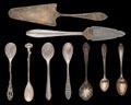 Vintage Silverware, antique spoons, knives, cake shovels isolated on isolated black background. Antique silverware. Retro Royalty Free Stock Photo