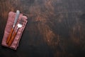 Vintage silverware. Rustic vintage set of wooden spoon and fork on black wooden background. Empty dishes. Top view. Mock up Royalty Free Stock Photo