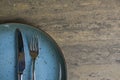 Vintage silverware on rustic wooden background. Top view of kitchen cutlery setting on grunge restaurant table Royalty Free Stock Photo