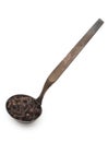 Vintage silverware, Very old dark rusted ladle, scoop with spices, carnation, clove, isolated on a white, close up