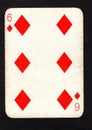 A vintage six of diamonds playing card on a black background. Royalty Free Stock Photo