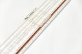 Vintage slide rule on a white background