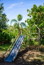 Vintage Sliders in the park, Old Children kid playground, light & shadow Royalty Free Stock Photo