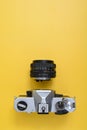 A vintage SLR camera with chrome body. Royalty Free Stock Photo