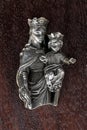 Vintage small idol of Mary and child jesus on wooden plank