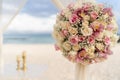 Romantic decoration with flowers of a beach wedding on the beach with sea in the background Royalty Free Stock Photo