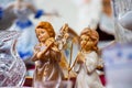 Vintage souvenir angels and porcelain dishes in a market