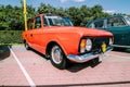 Vintage soviet IZh-412 car at retro show. Moskvich 412 auto in Orange Red colour