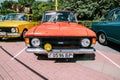 Vintage soviet IZh-412 car at retro show. Moskvich 412 auto in Orange Red colour
