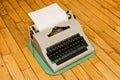 Vintage Soviet typewriter on a wooden floor